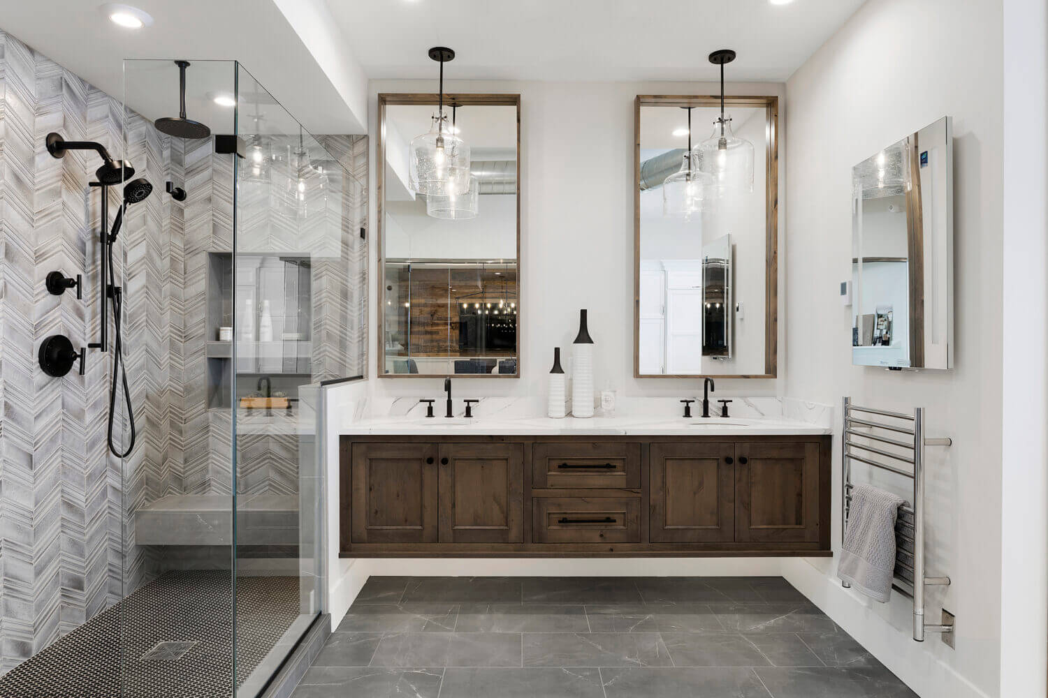 A large bathroom with floating double vanities
