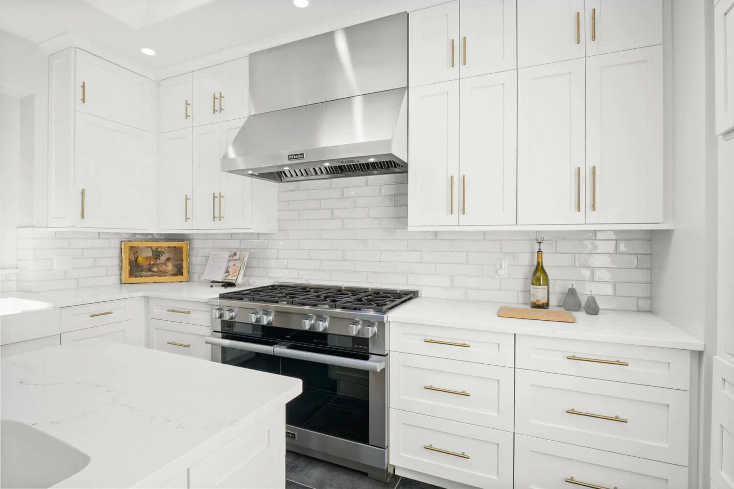 White kitchen with wall of storage cabinets