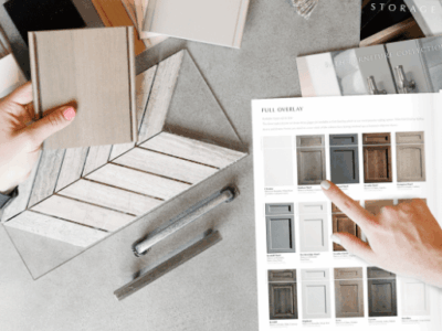 homeowners reviewing cabinet color samples