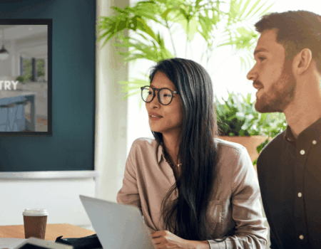 couple in a meeting discussion cabinetry prices ranges